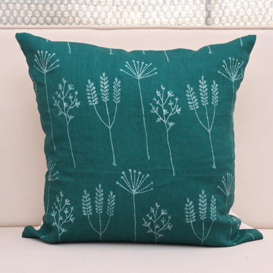 Teal wild meadow block print linen pillow cover styled on a sofa